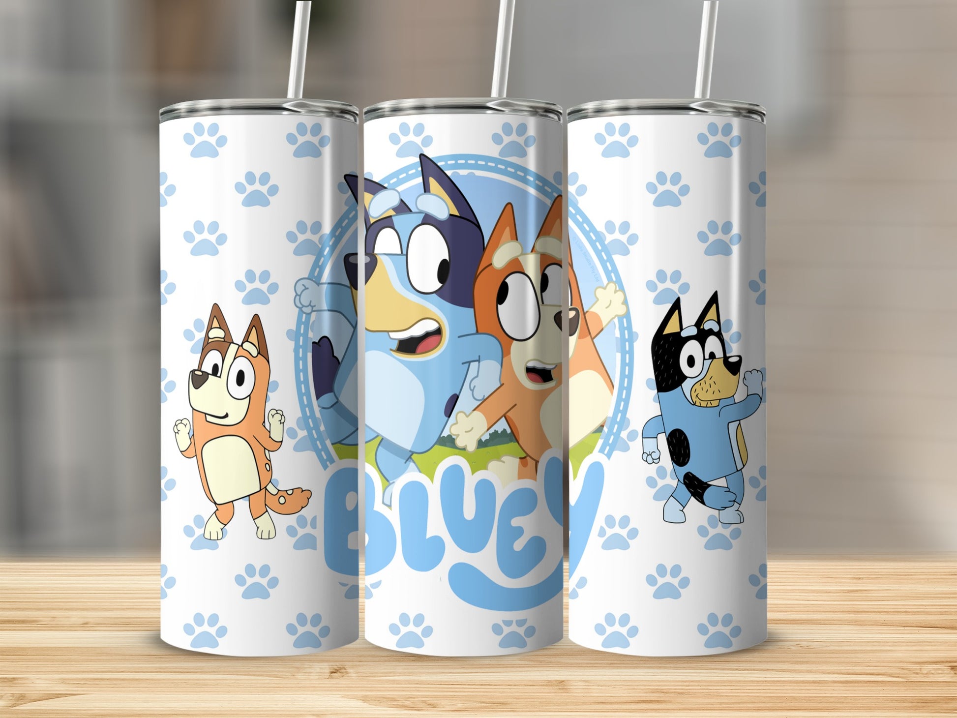 Bluey characters on white tumbler with blue paw prints and text.