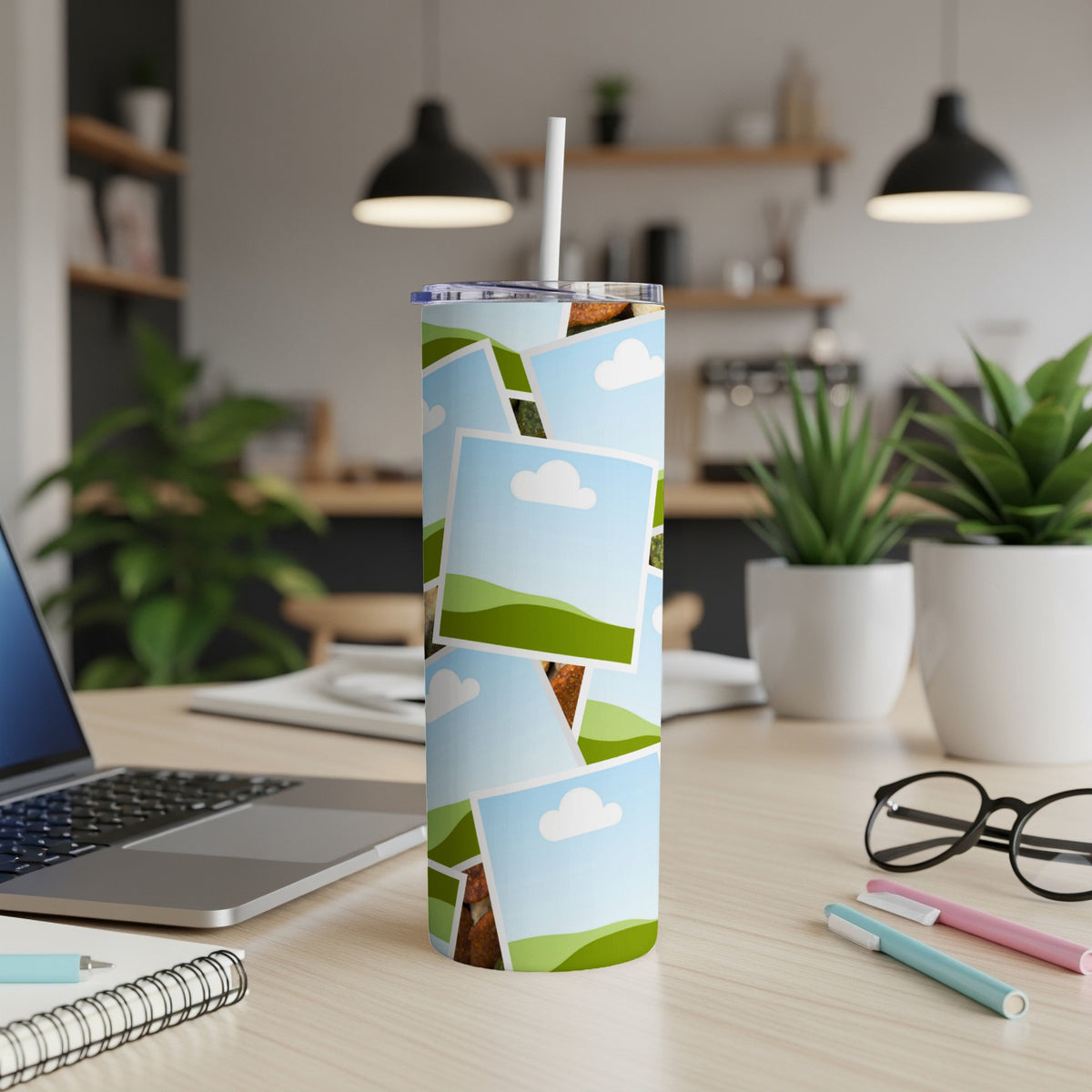 Tumbler with a collage of framed photos featuring sky, clouds, and green hills.