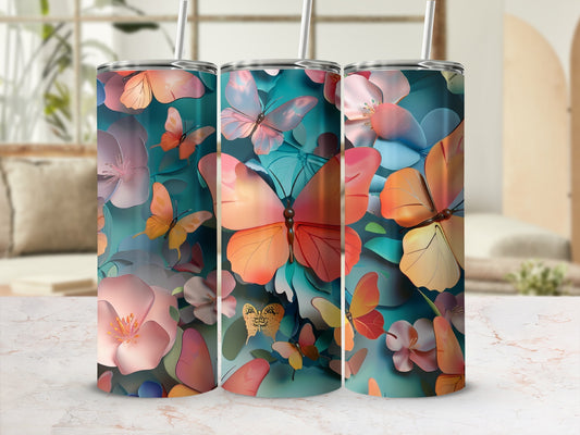 Three tumblers with a colorful butterfly and floral design.