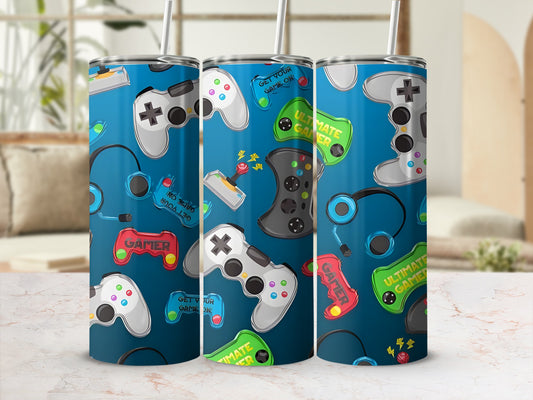 Blue tumbler with video game controllers, headphones, and "Ultimate Gamer" text.