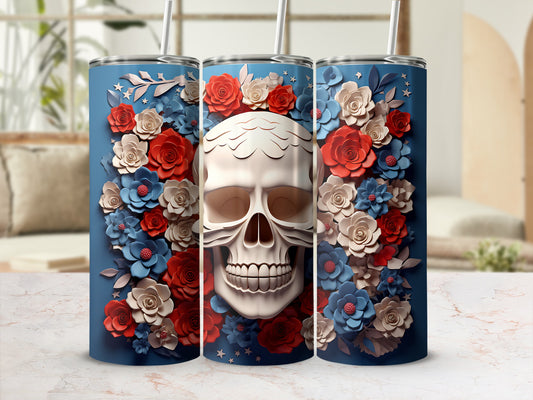 Blue tumbler with skull and red and blue floral design.