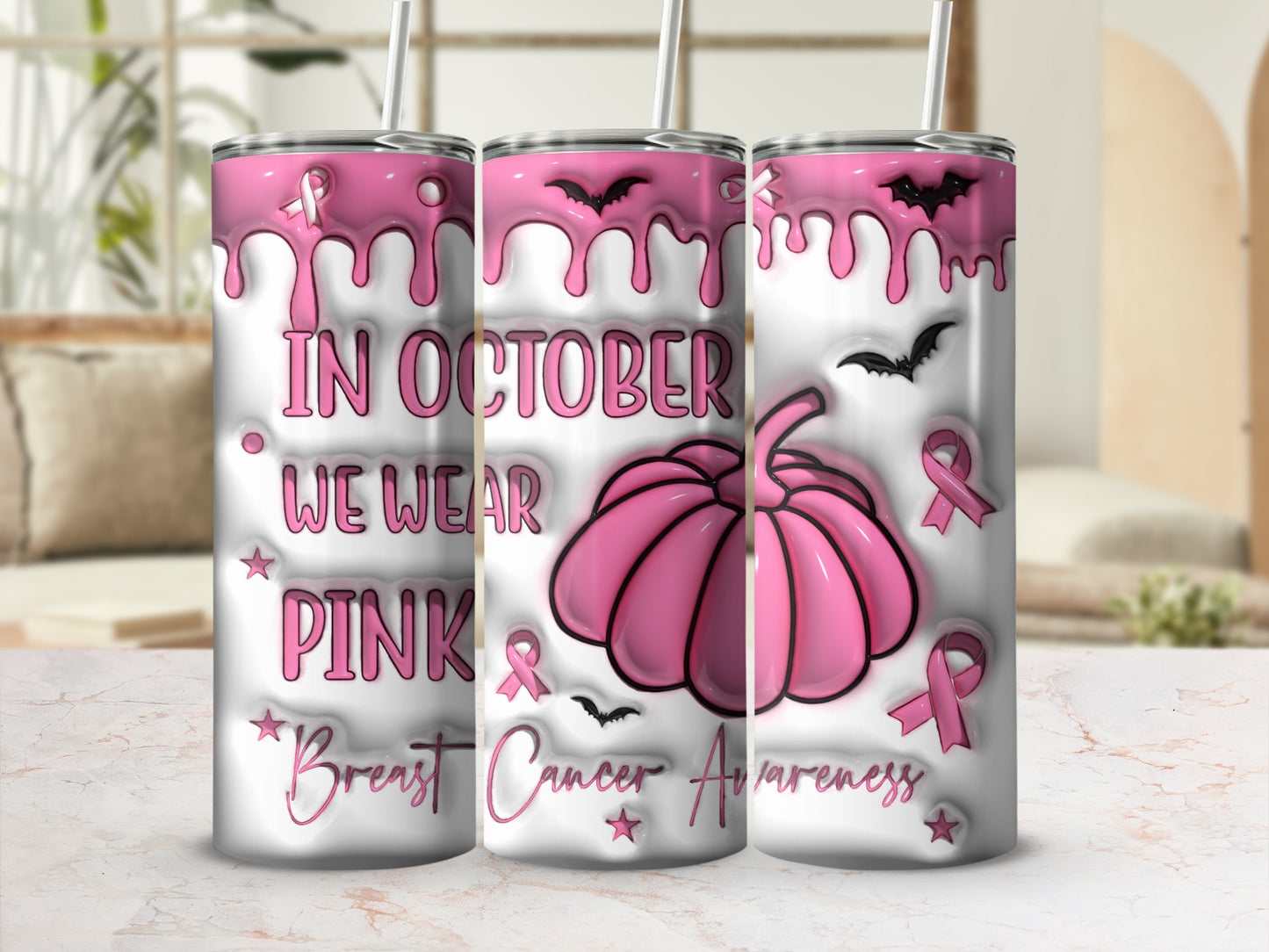 Pink dripping design with pumpkin, bats, and text "In October We Wear Pink Breast Cancer Awareness".