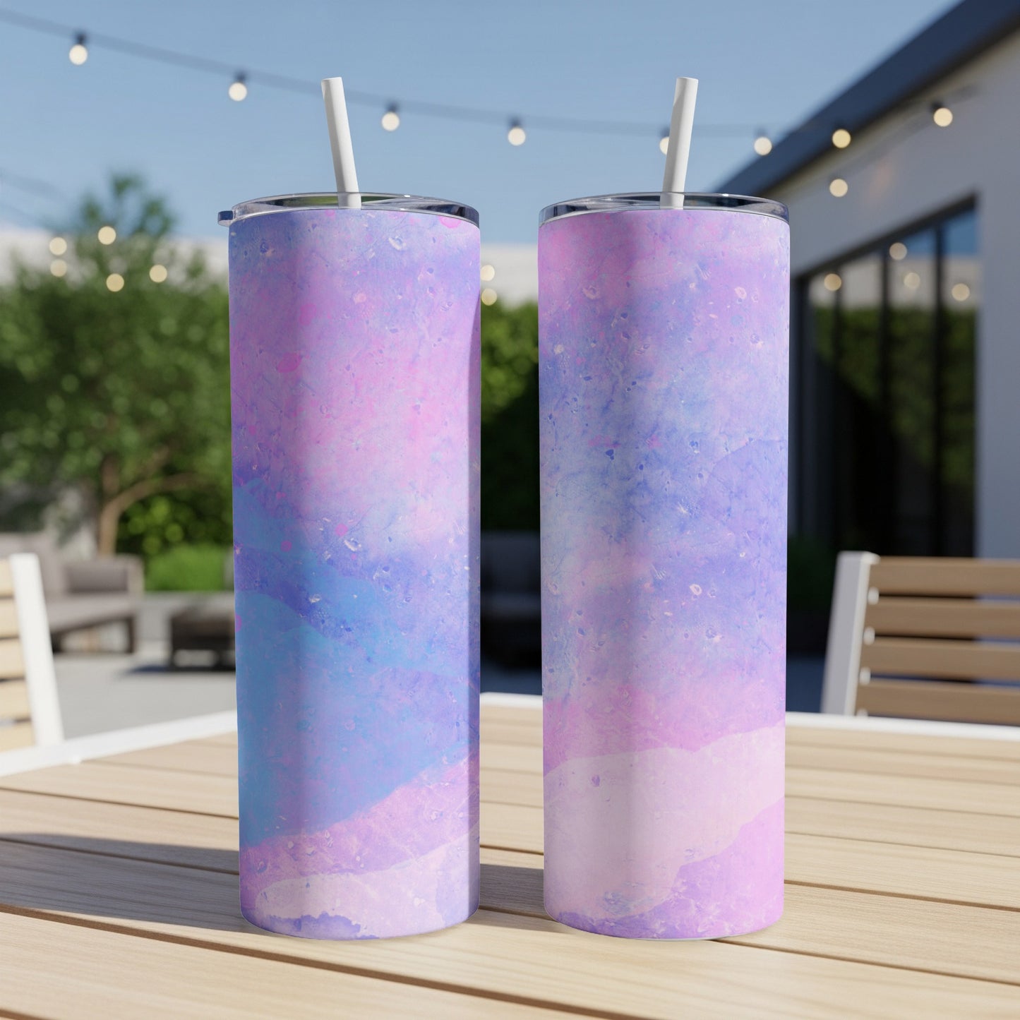 Two tall tumblers with pink, blue, and purple watercolor design.