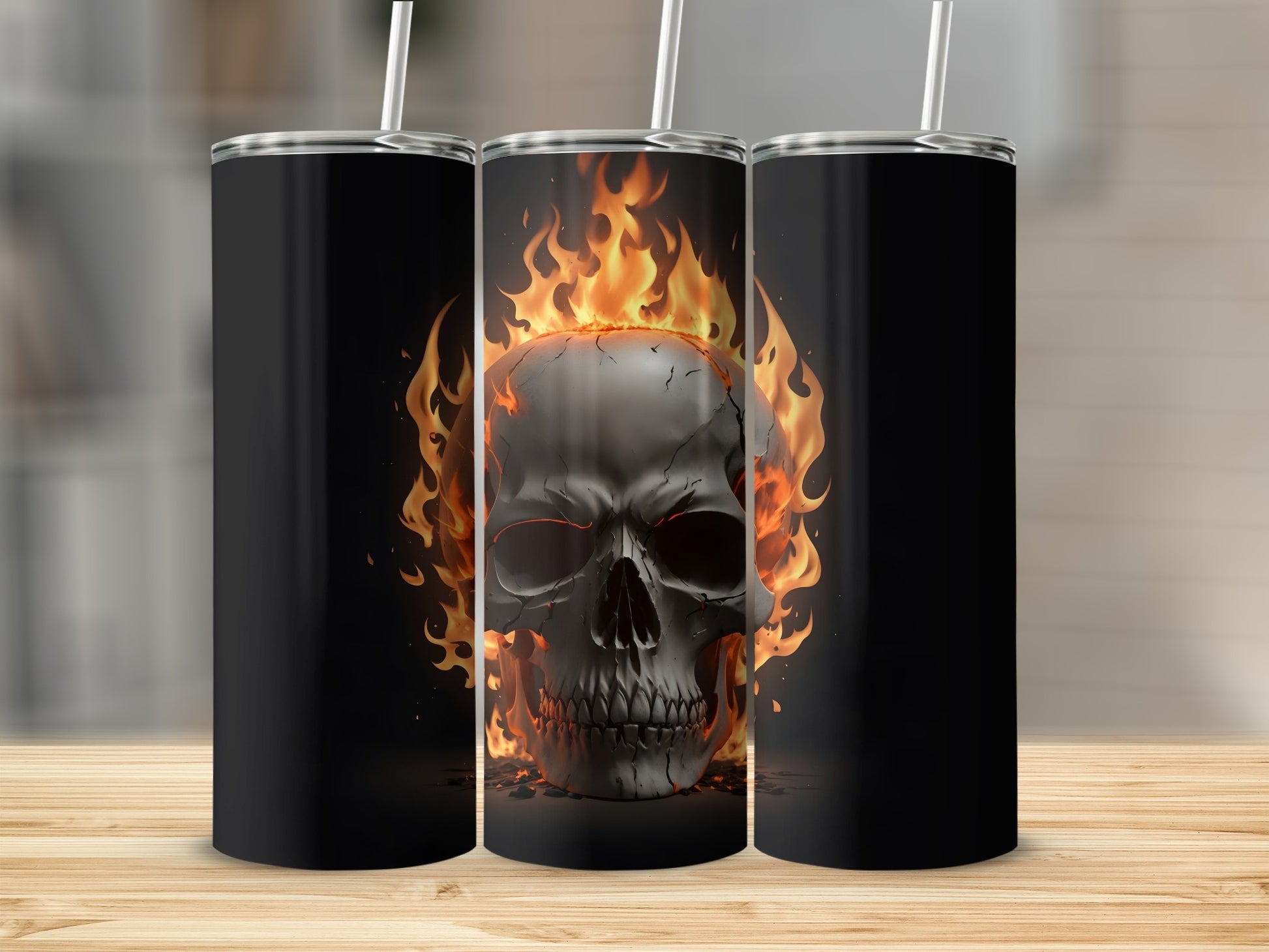 Black tumbler with flaming skull design on a wooden surface.