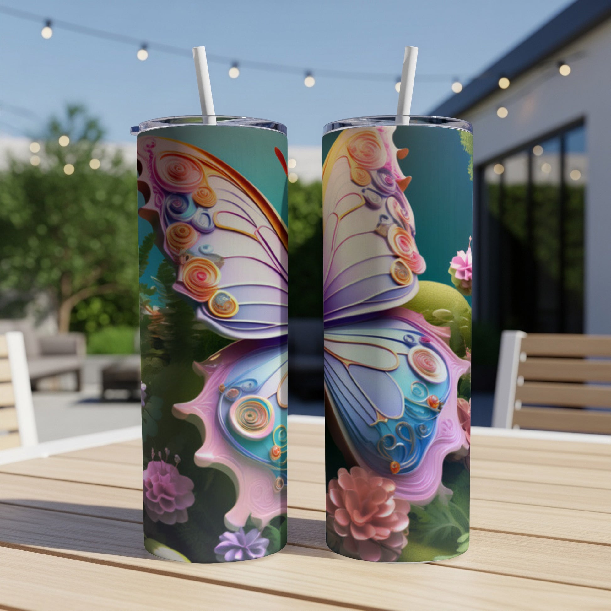 Two tumblers with colorful butterfly wings design on a wooden table.
