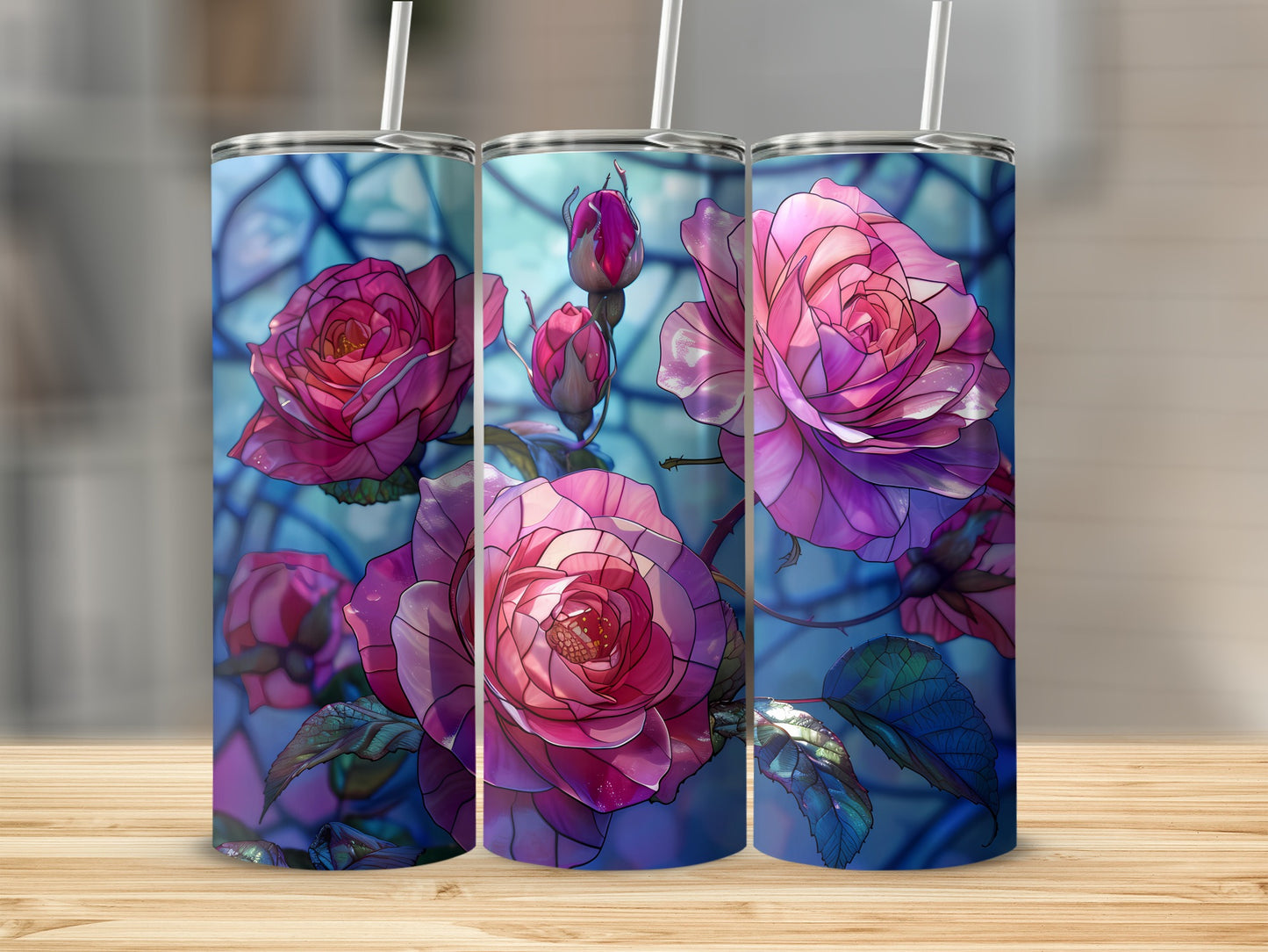 Three tumblers with stained glass style pink roses on a wooden surface.
