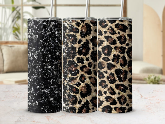 Three tumblers: one black speckled, two leopard print.