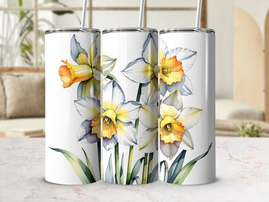 Three white and yellow daffodils with green leaves on tumblers.