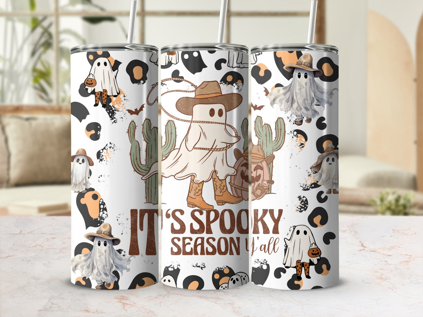 Tumblers with cowboy ghosts, cacti, and "It's Spooky Season Y'all" text.