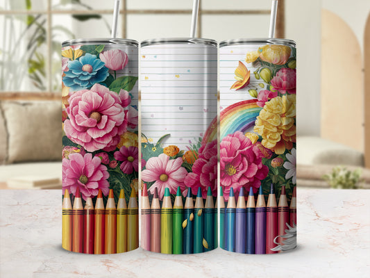 Three tumblers with floral and rainbow designs, separated by pencils.