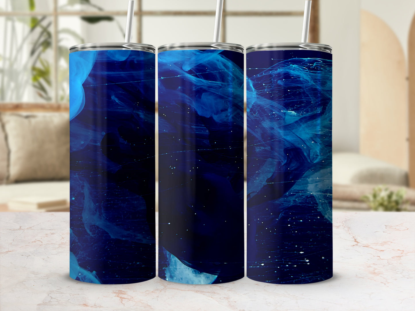 Three tumblers with swirling blue abstract design and white speckles.