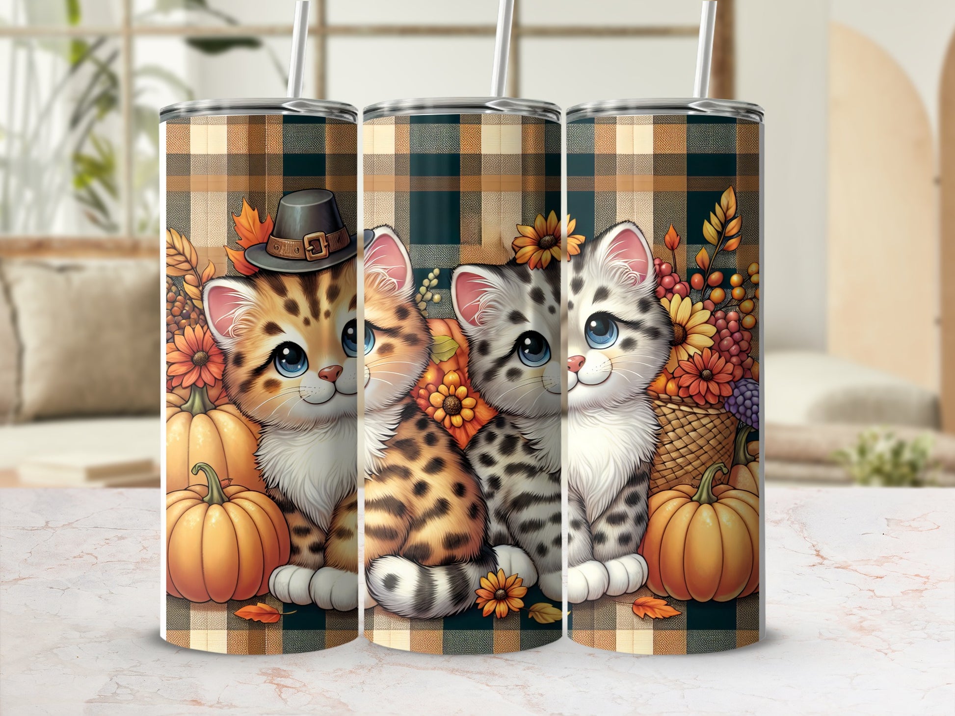 Two cute kittens sit among pumpkins and sunflowers on plaid tumblers.