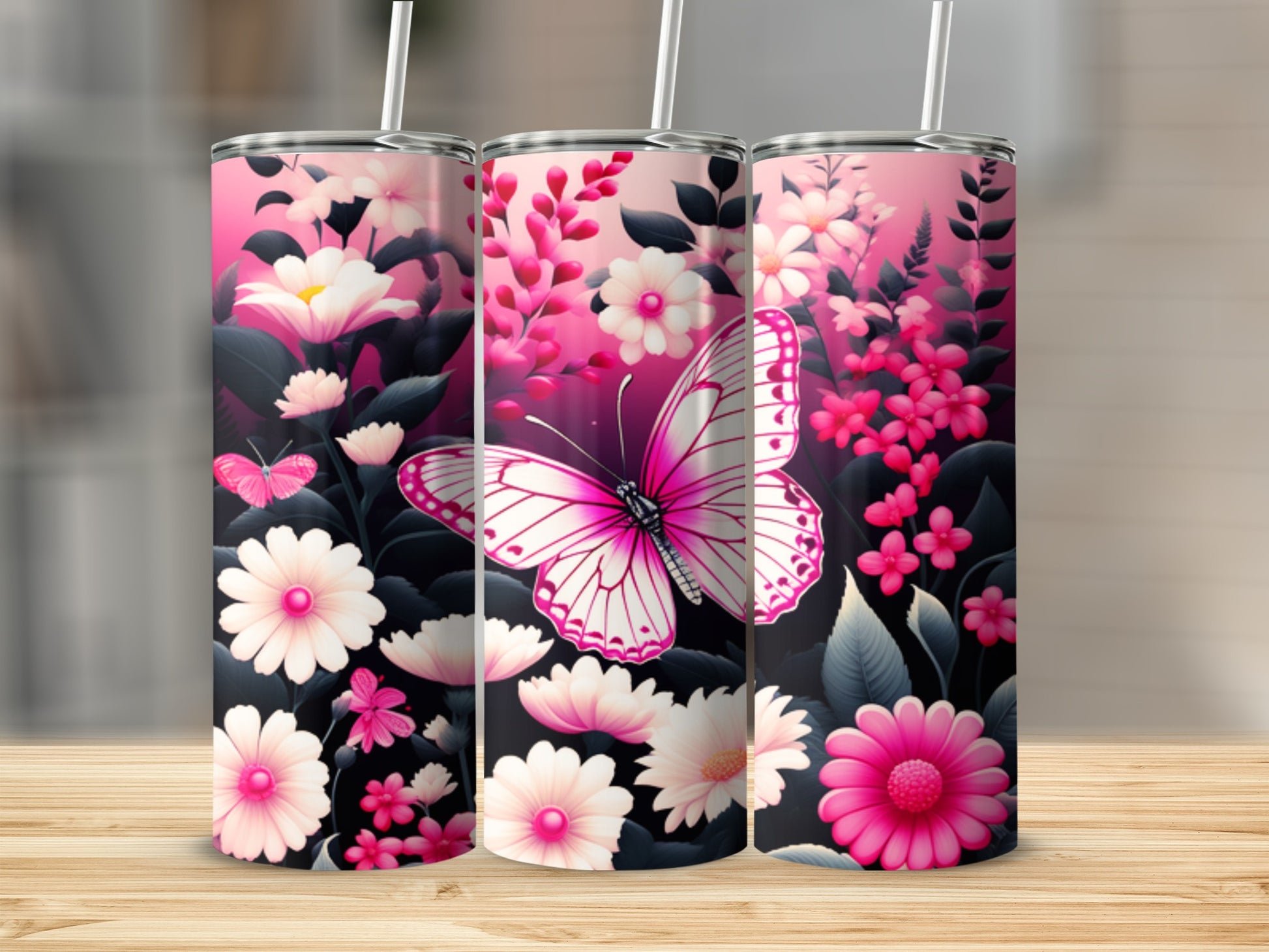 Pink floral and butterfly design on three tumblers.