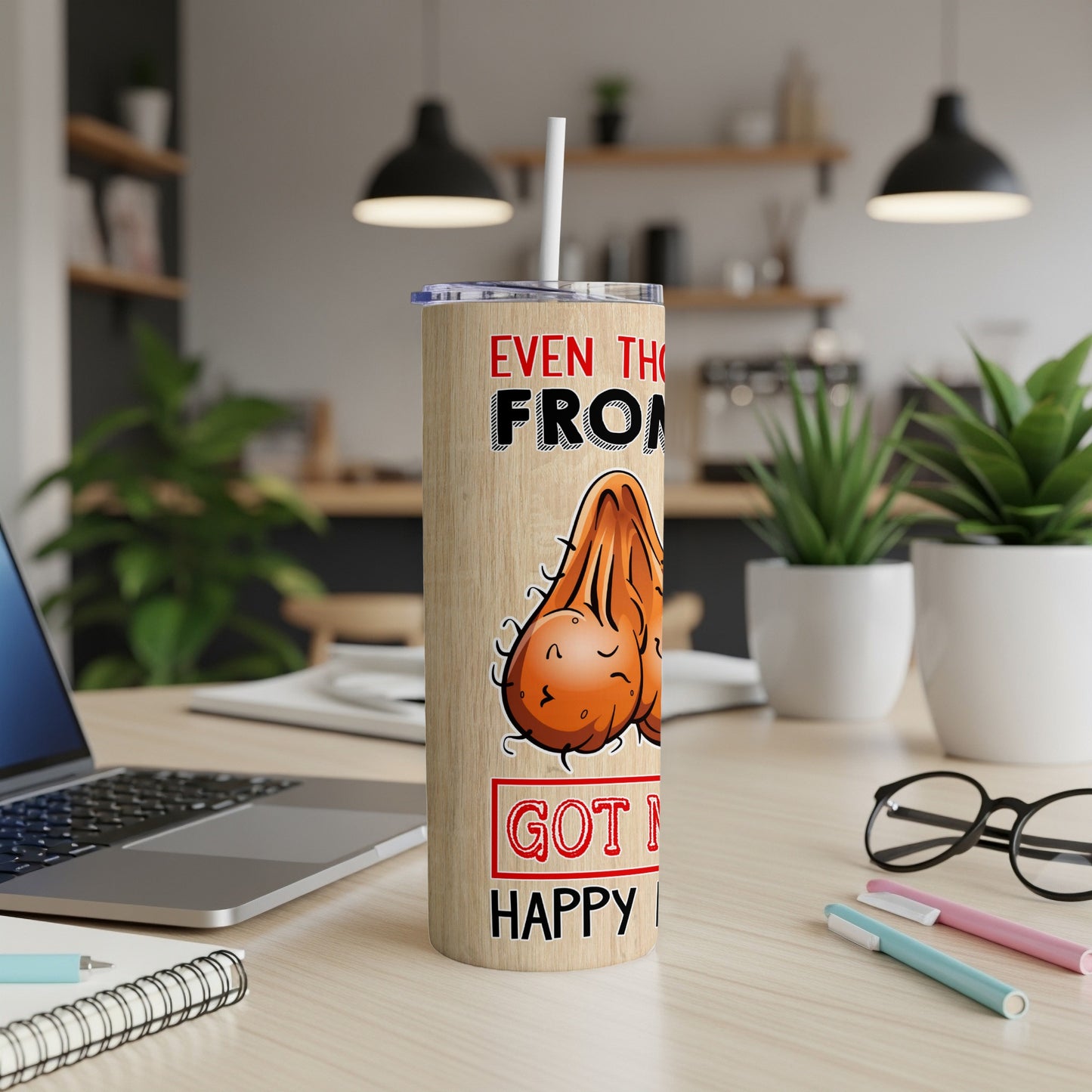 Woodgrain tumbler with humorous text and illustration of testicles.