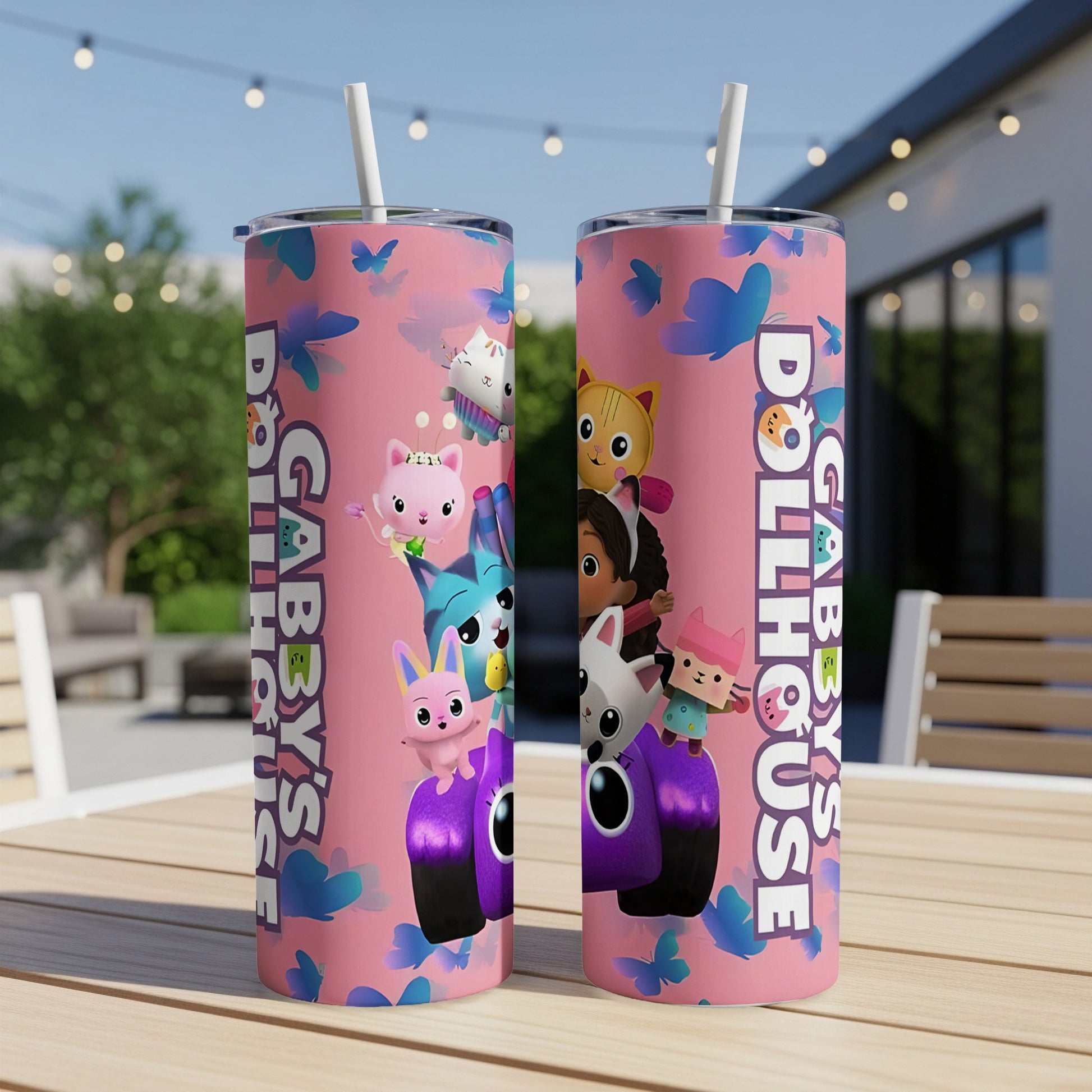Gabby's Dollhouse characters on a pink tumbler with butterflies.