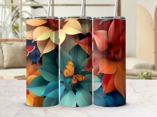 Three tumblers with floral and butterfly designs in warm, vibrant colors.