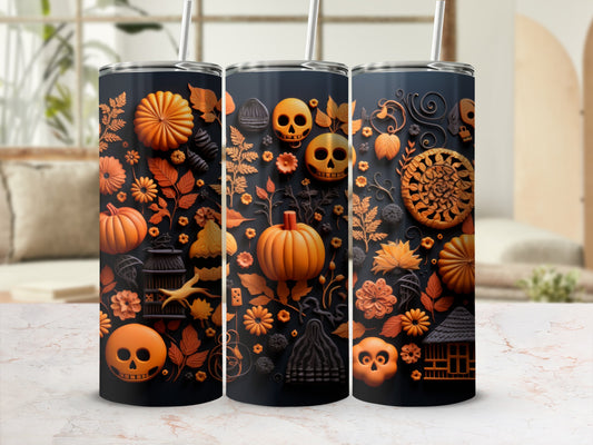 Three tumblers with Halloween-themed orange and black raised designs, including pumpkins and skulls.
