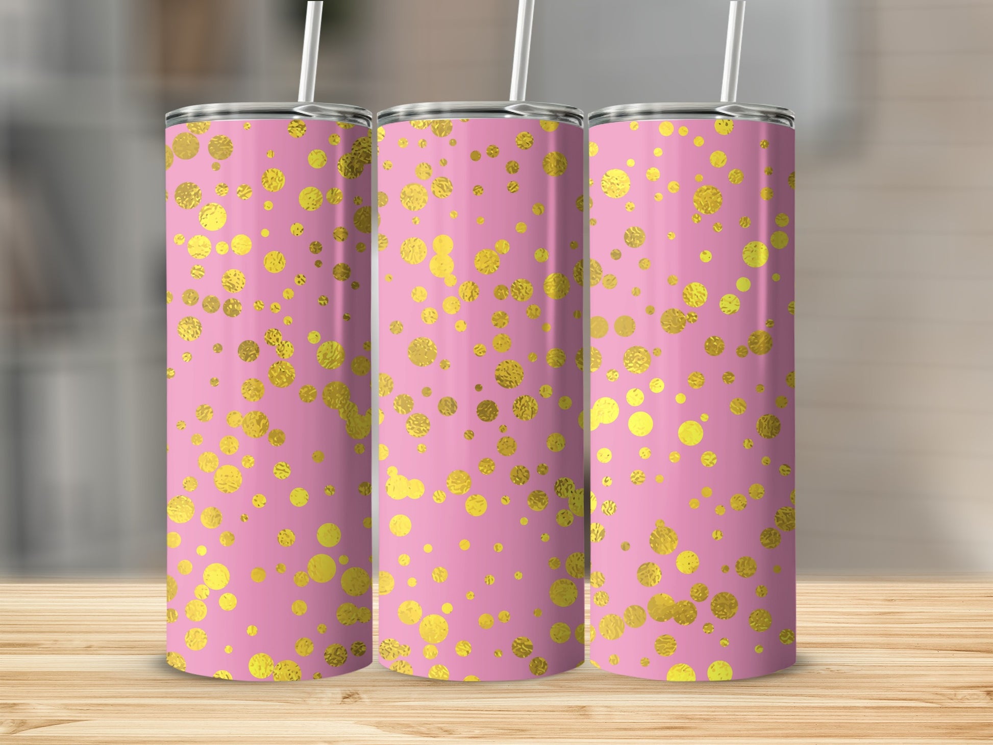 Three pink tumblers with gold confetti pattern and white straws.