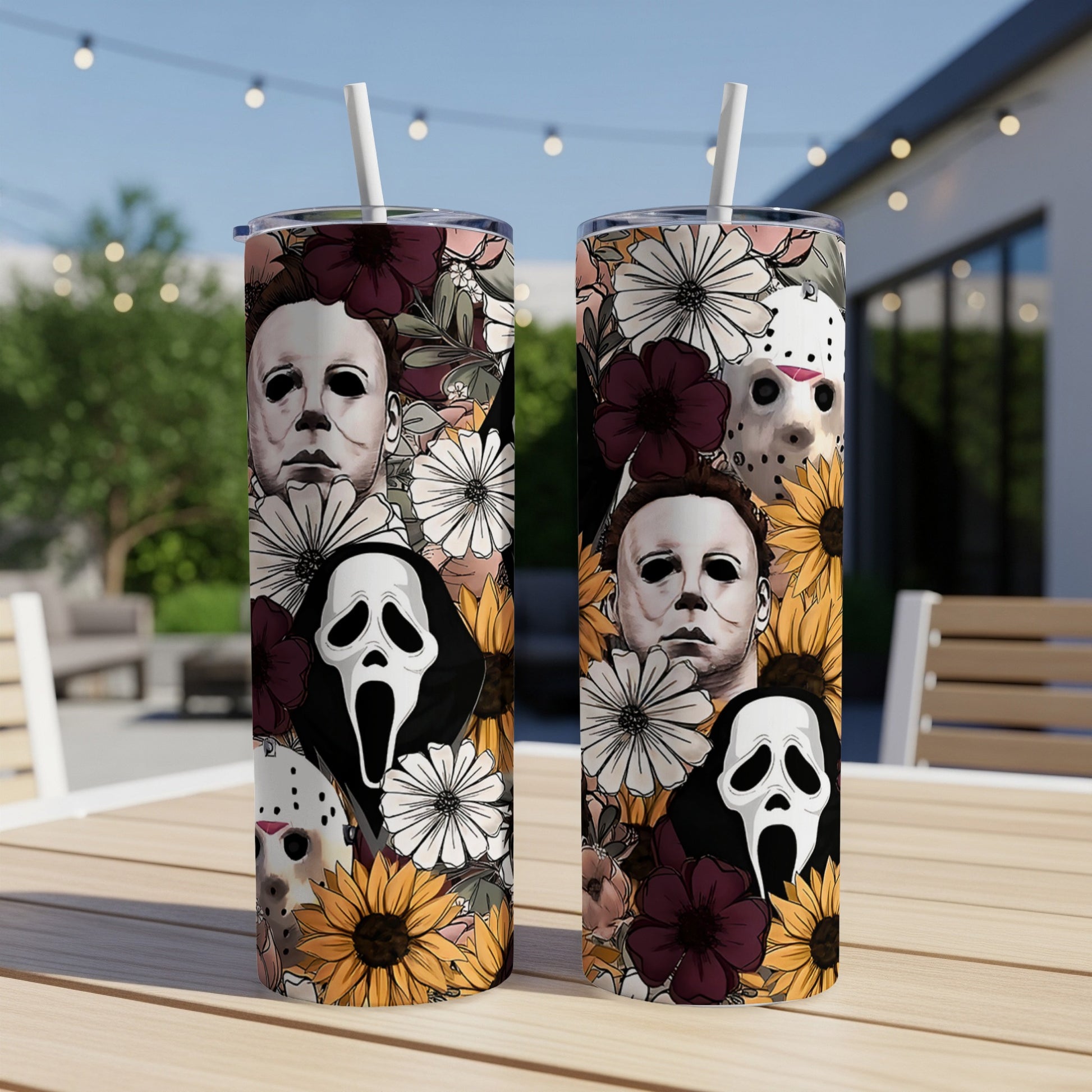 Two tumblers with horror movie characters and floral patterns.