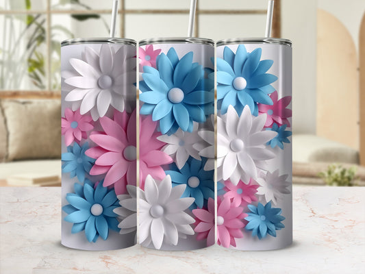 Three tumblers with floral designs in pink, white, and blue.