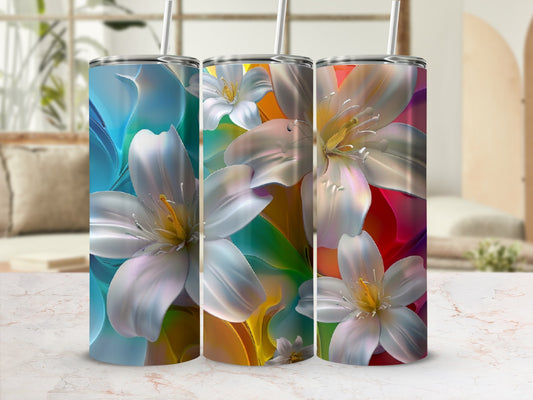 Three tumblers featuring white and yellow lilies against a colorful, blurred background.