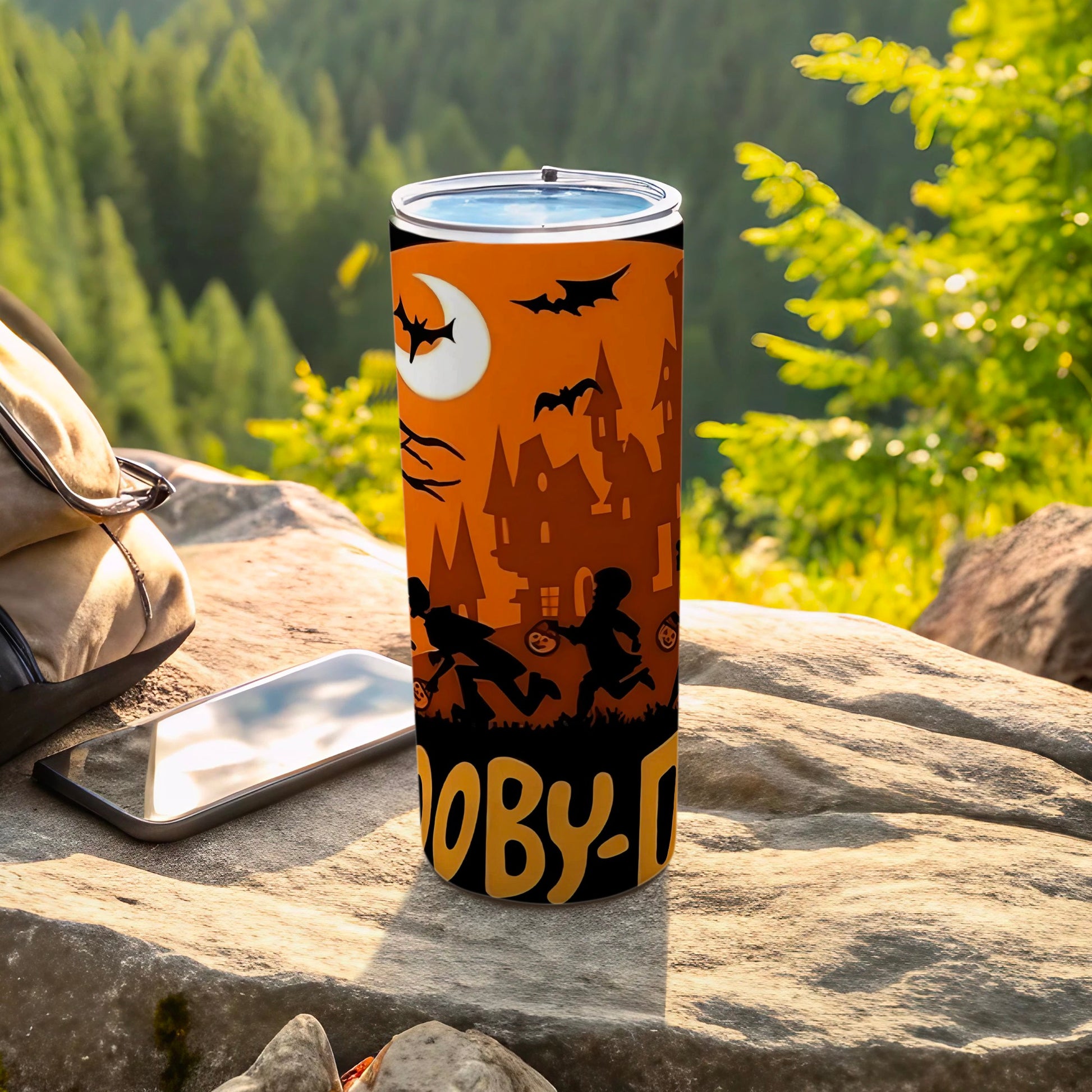 Scooby-Doo Halloween tumbler with haunted house, bats, and trick-or-treaters.