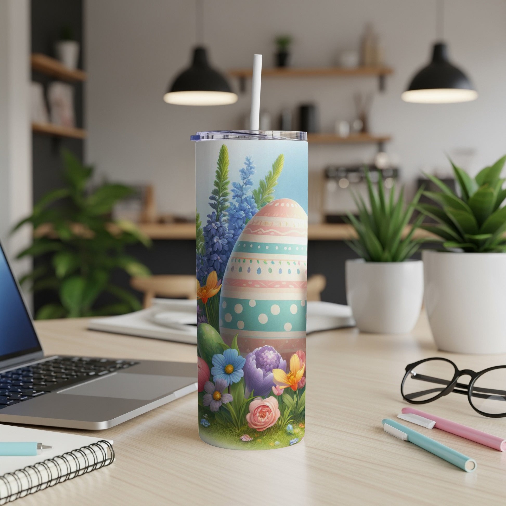 Easter egg and floral design on a tall white tumbler with straw.