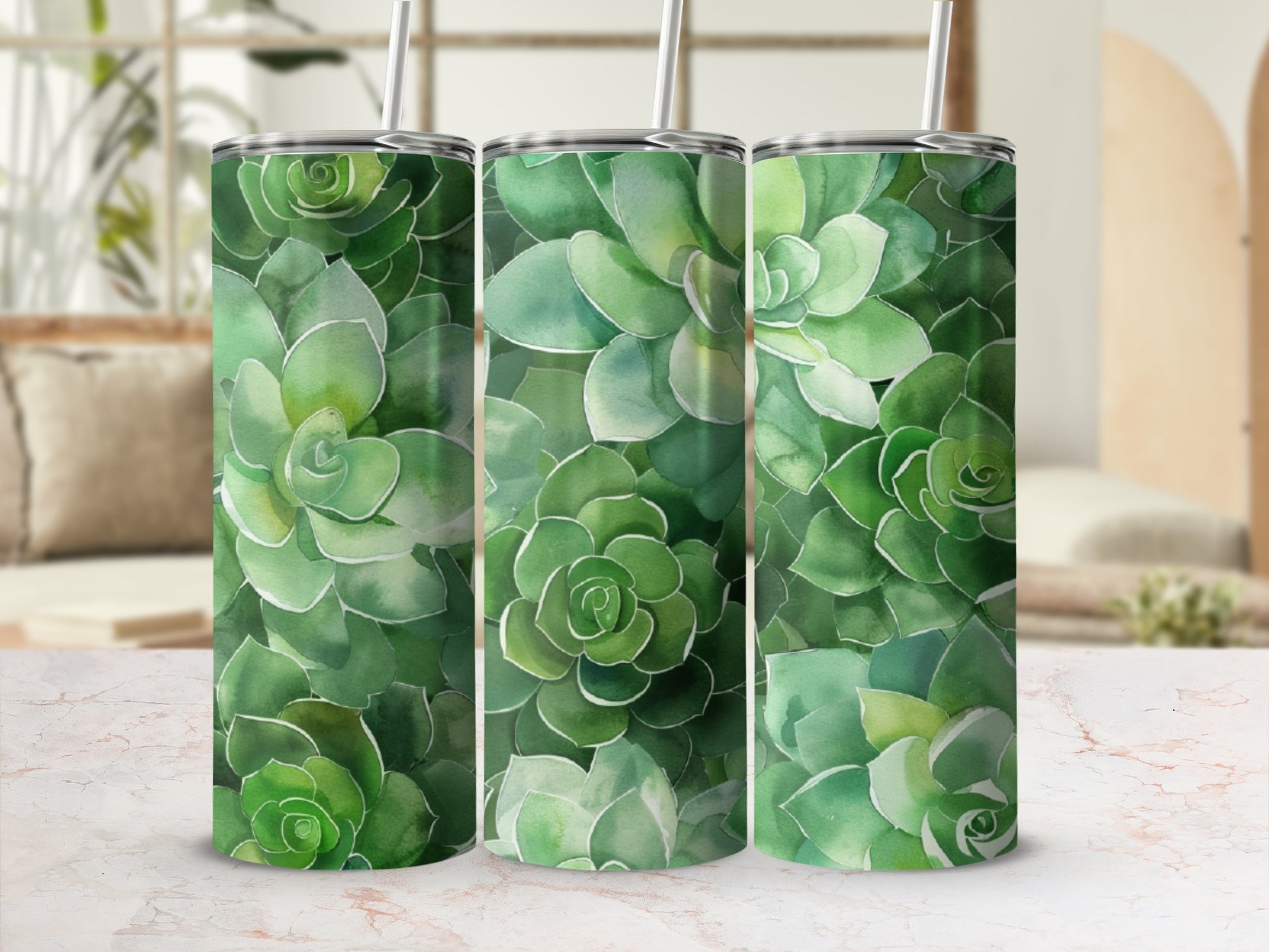 Green succulent plant pattern on three tumblers with straws.
