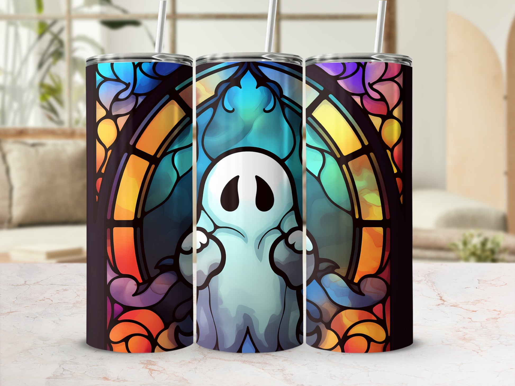 Stained glass ghost on a patterned tumbler with a straw.