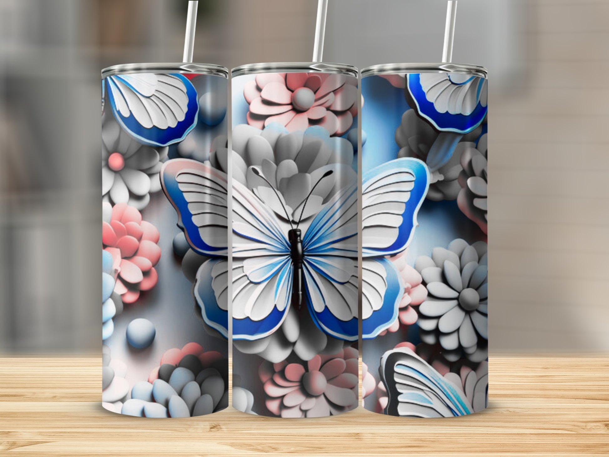 Three tumblers featuring a blue and white butterfly on a floral background.