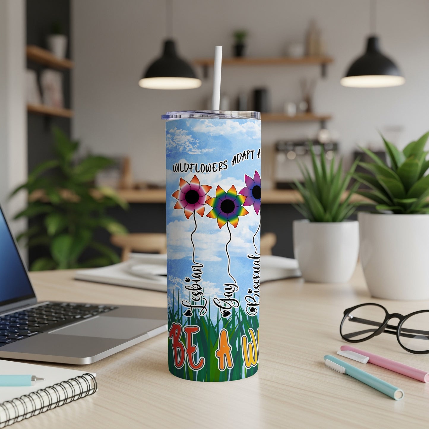 Tall tumbler with wildflowers and "BE A WILDFLOWER" text.