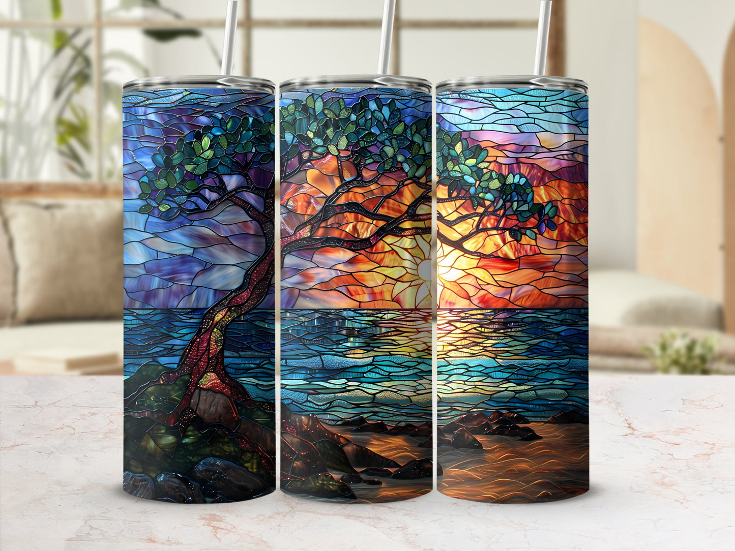 Three stained glass tumblers with a tree and sunset scene.