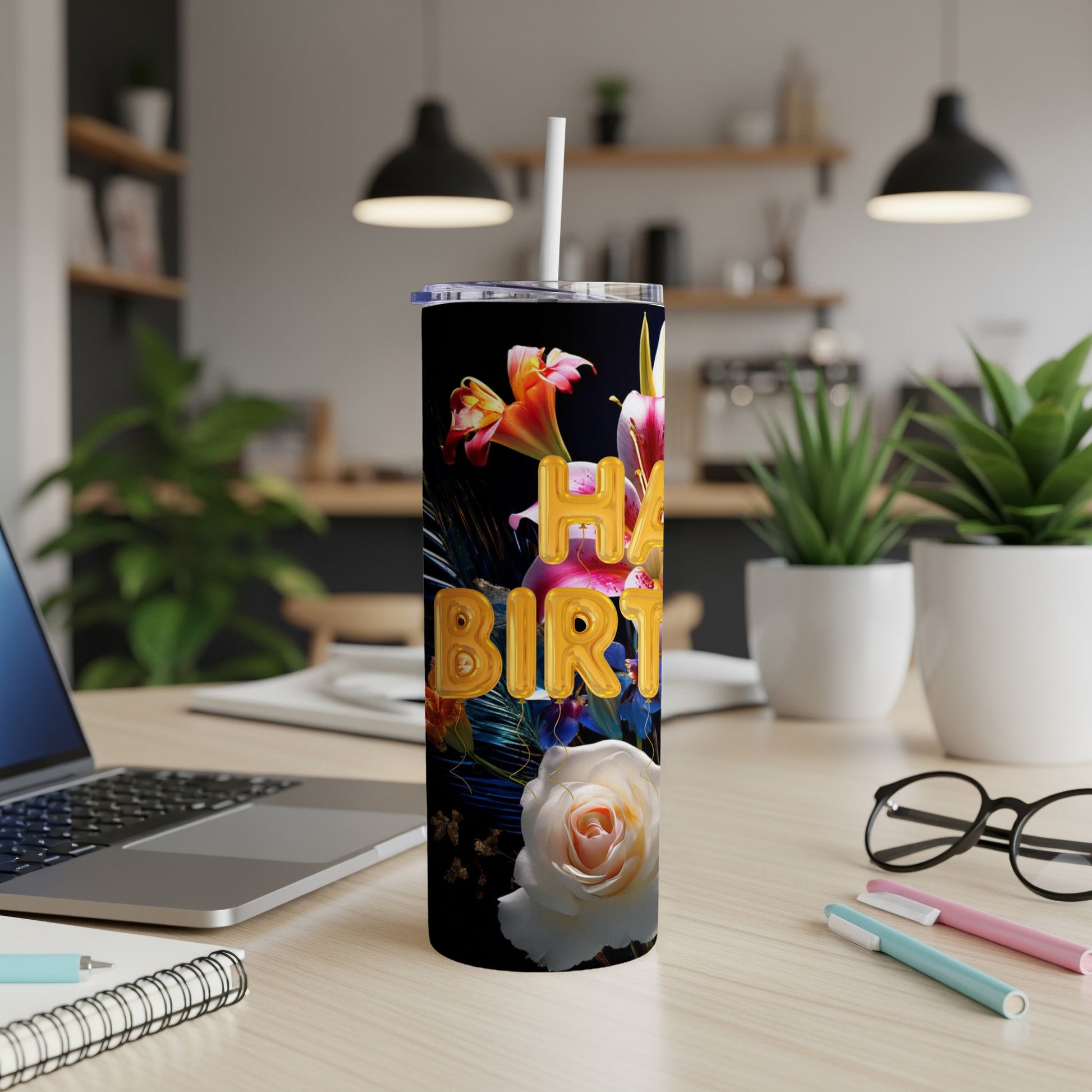 Black tumbler with "Happy Birthday" in gold balloons and floral accents.