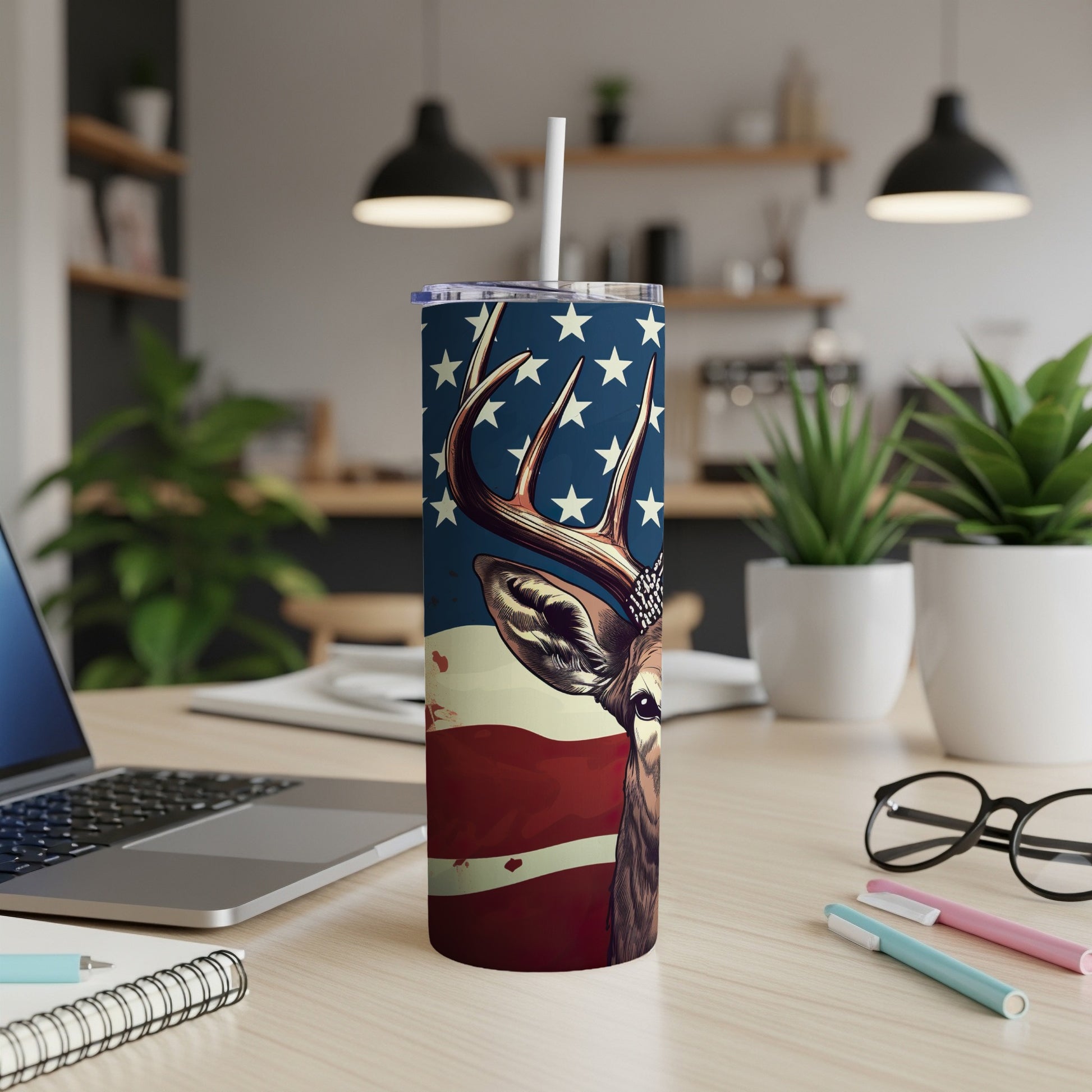 Deer head with American flag pattern on a tumbler with straw.