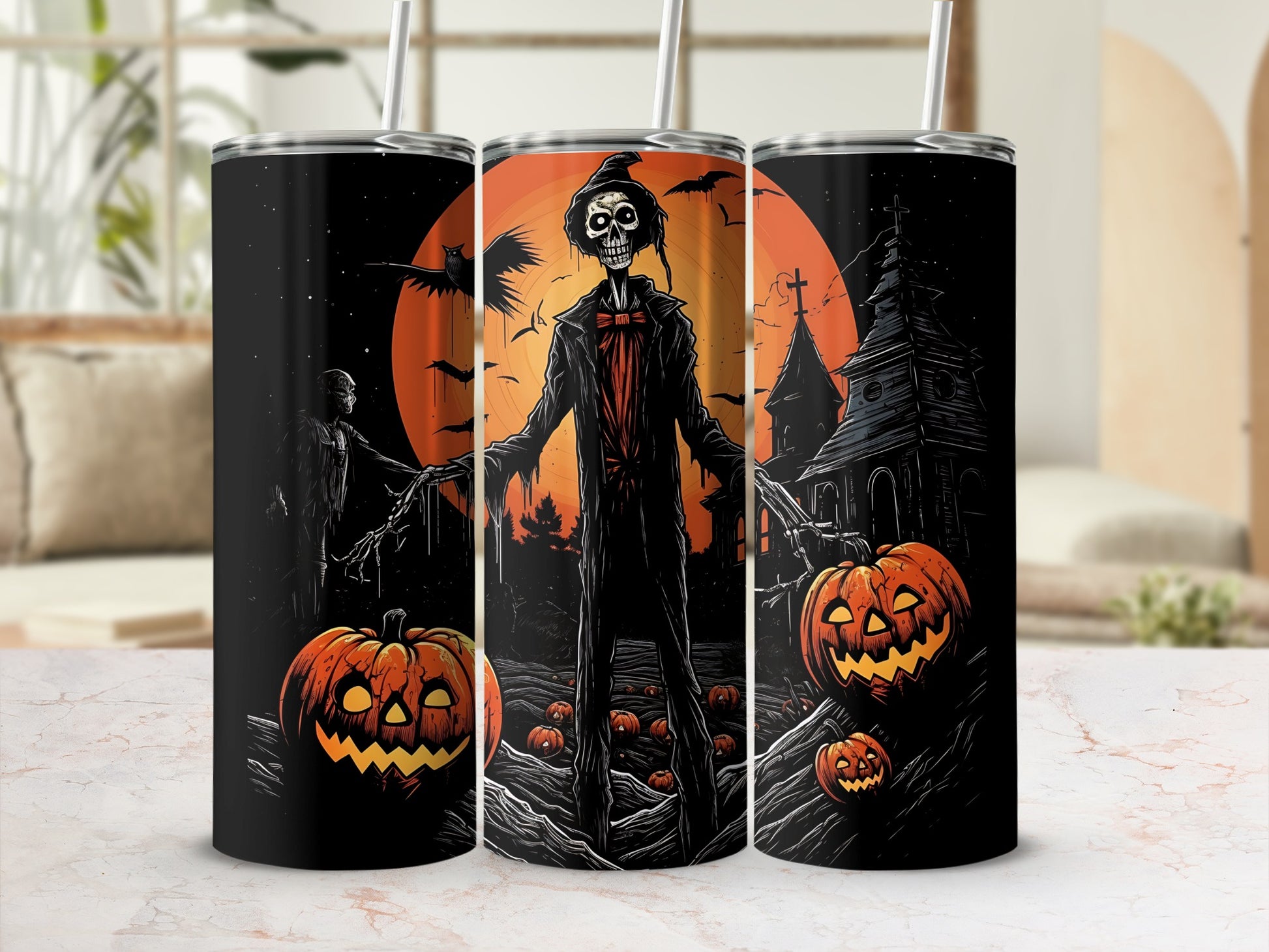 Halloween tumblers featuring a skeleton, bats, pumpkins, and a spooky haunted house.