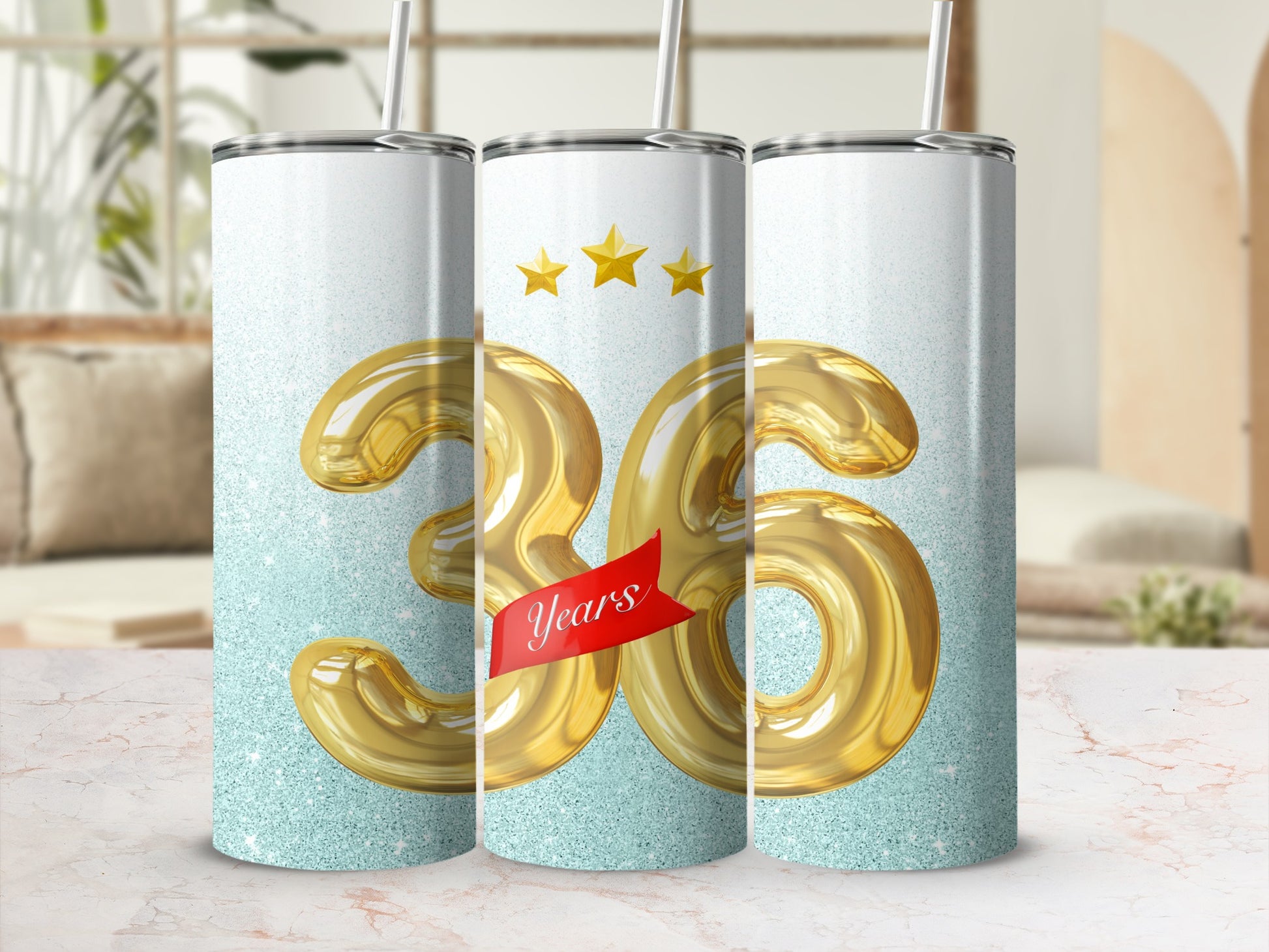 Three tumblers with large gold "36" design and sparkly background.