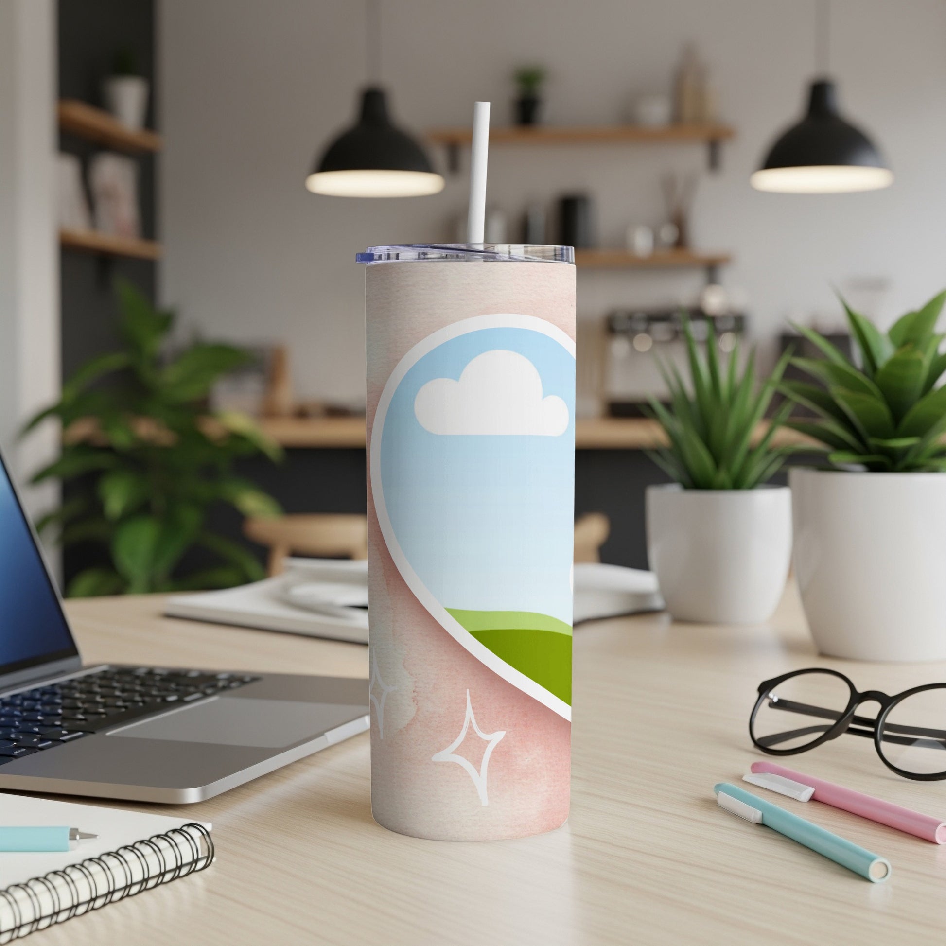 Tall tumbler with pink watercolor and cloud design, featuring a straw.