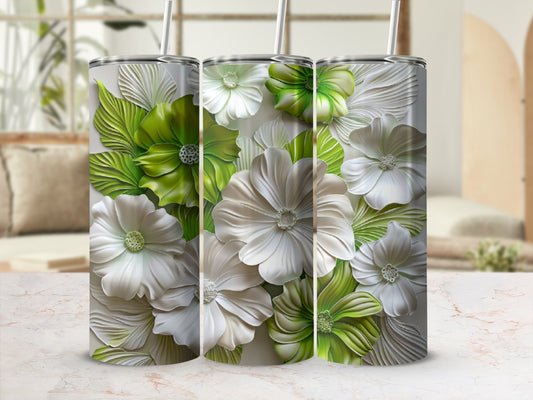 White and green embossed floral pattern on a cylindrical tumbler.