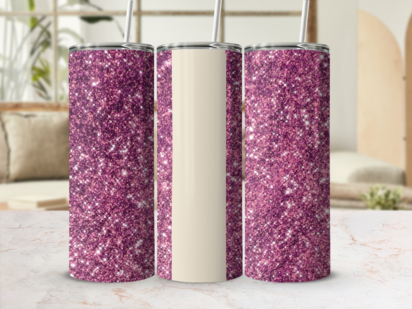 Three glittery purple tumblers with straws on a marble surface.