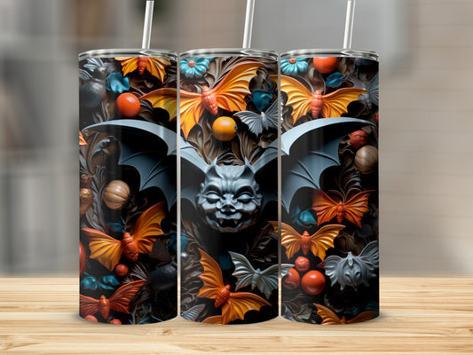 Three tumblers with a Halloween-themed design featuring bats, pumpkins, and floral elements.