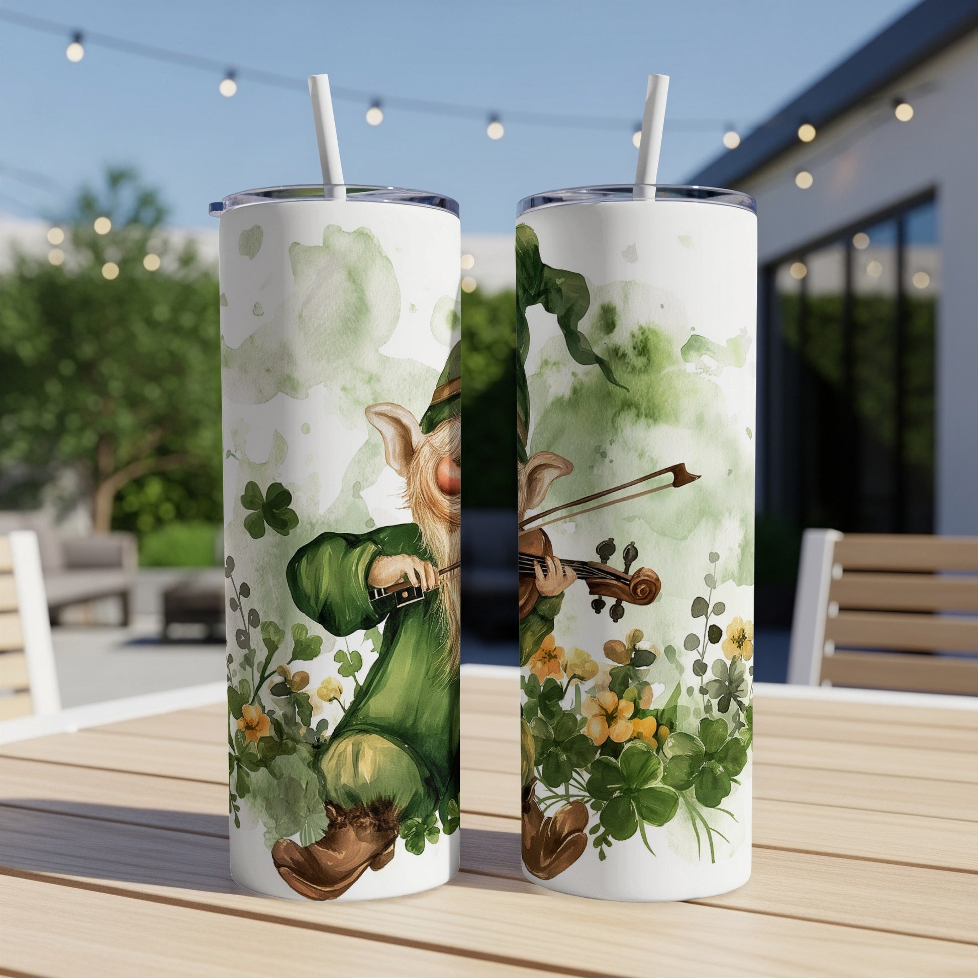 St. Patrick's Day tumbler with a leprechaun playing a violin amidst shamrocks.