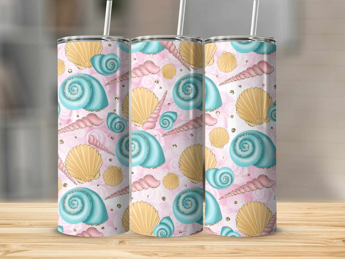 Three tumblers with a pink seashell and pearl pattern.