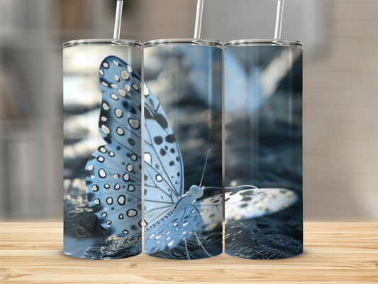 Three tumblers featuring a light blue butterfly with white spots.