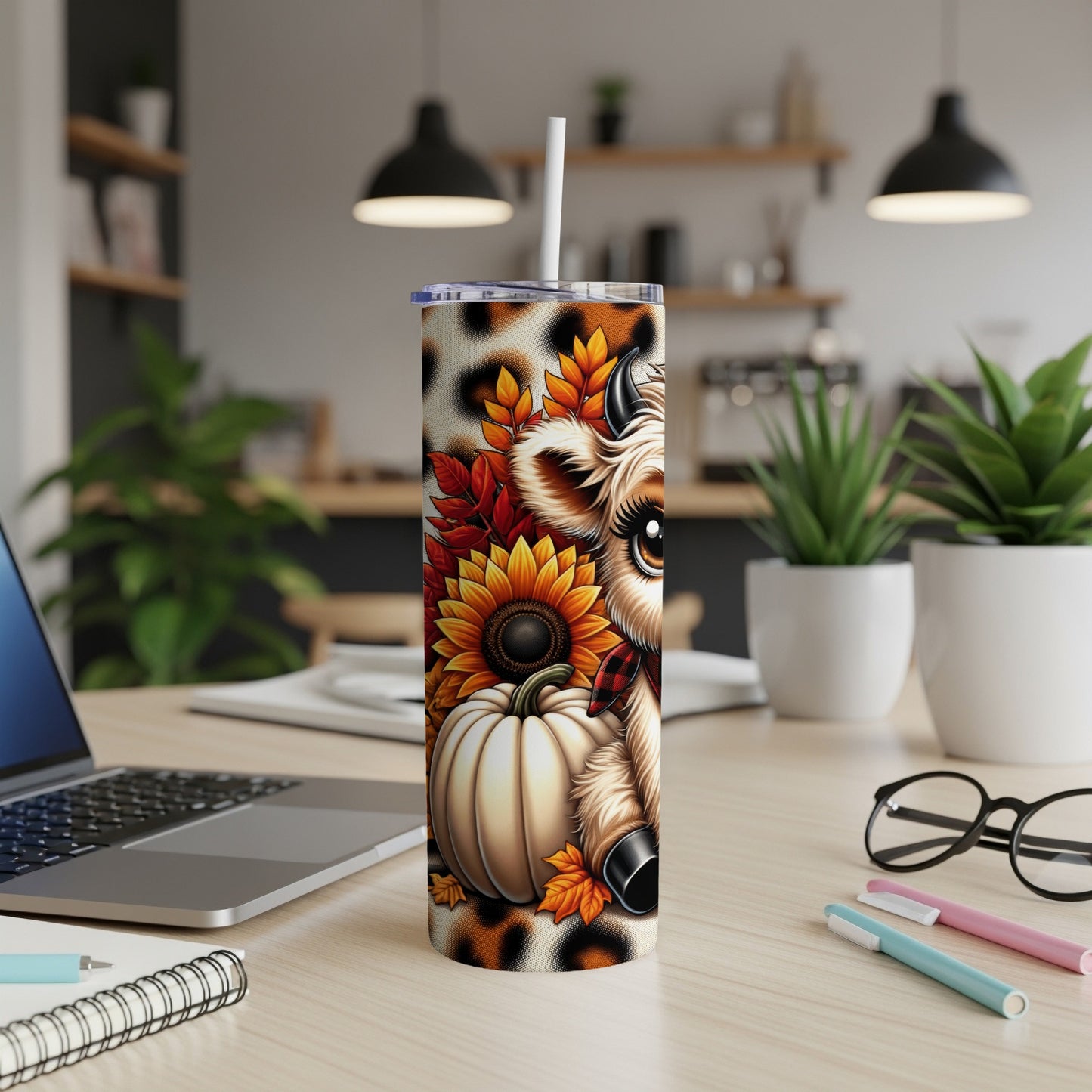 Cute cow with pumpkin, sunflower, and autumn leaves on a tumbler.