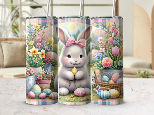 Easter bunny holding egg with floral and pastel checkered background.