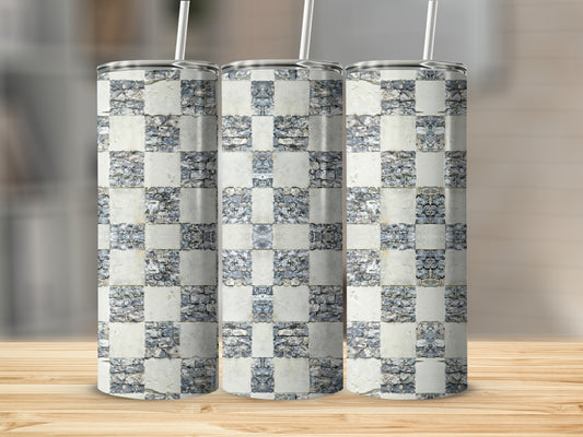 Three tall tumblers with a stone checkerboard pattern, on a wooden surface.
