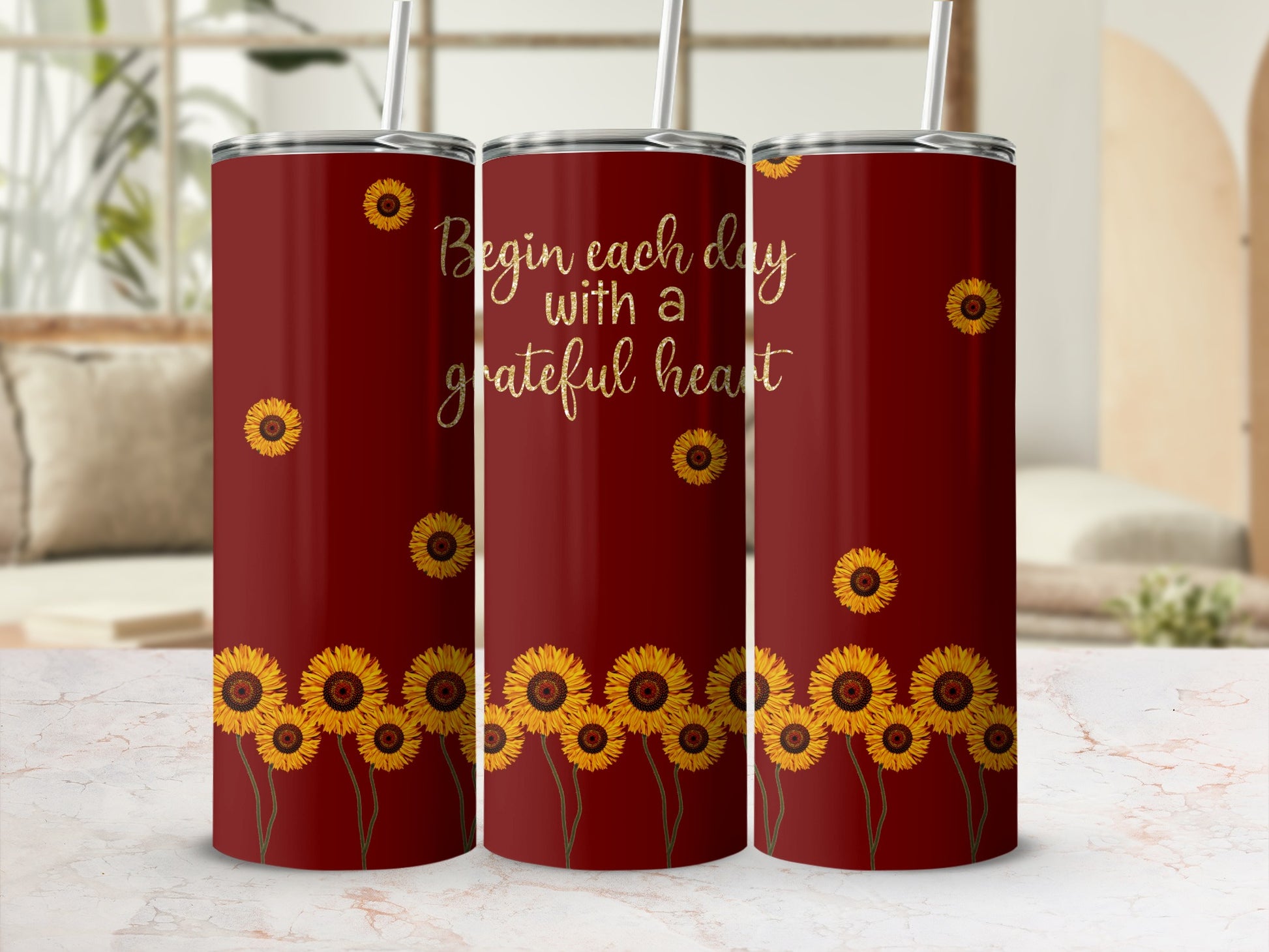 Red tumbler with sunflowers and "Begin each day with a grateful heart" text.