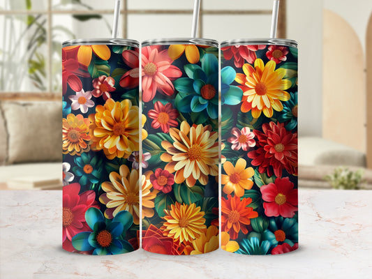 Three tumblers with a vibrant floral pattern in red, orange, yellow, and blue.