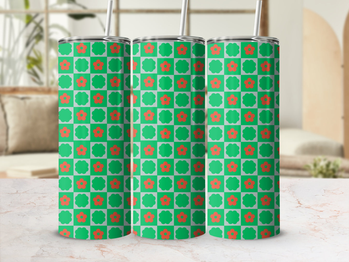 Green tumbler with coral flowers and checkered pattern.