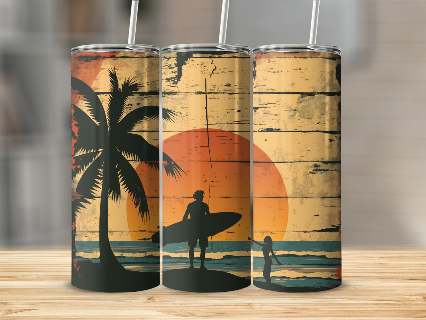 Three tumblers with a beach sunset and surfer design.